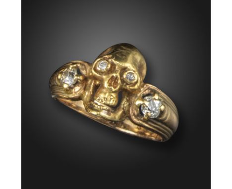 A diamond-set skull ring, the stylised skull with diamond-set eyes and further diamonds to the shoulders in yellow gold, size