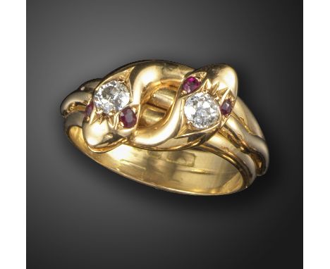 A Victorian gem-set double snake ring, the serpent heads each set with an old circular-cut diamond and with ruby eyes in gold