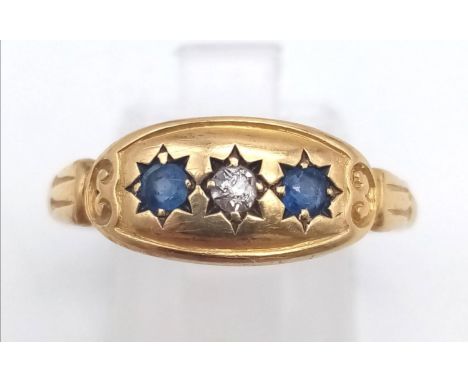 An 18 K yellow gold, vintage ring with blue sapphires and diamond, Ring size: T, weight: 3.3 g. 