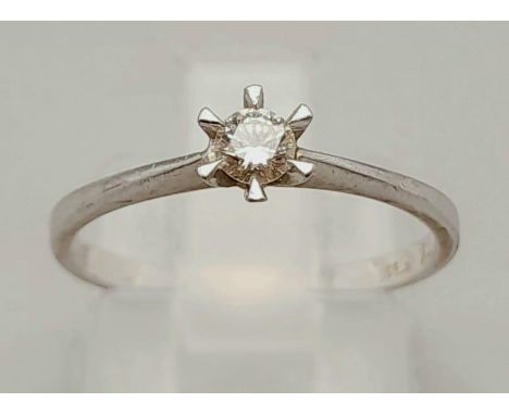 A 900 Platinum Solitaire Diamond Ring. 0.12ct. Size K.1.9g 