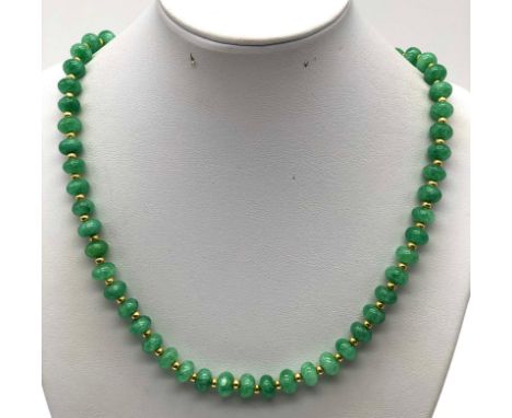 A Pale Green Jade Beaded Necklace. Gilded spacers and clasp. 46cm 