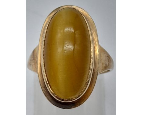 A 9K Yellow Gold Tigers Eye Ring. Oval cut - wonderful colours. Size K. 4.14g 