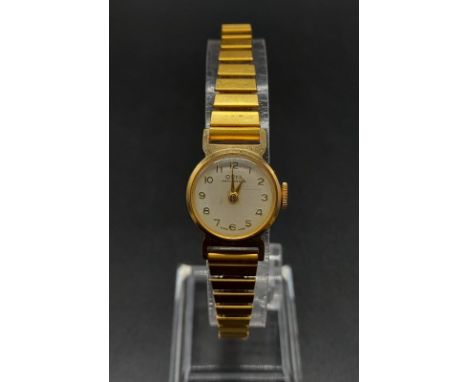 A VINTAGE ORIS ANTI SHOCK LADIES GOLD PLATED WRIST WATCH ON EXPANDABLE STRAP, MANUAL MOVEMENT FWO 