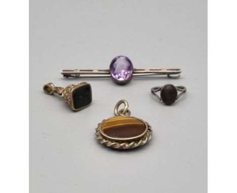 Four Victorian Solid Silver Pieces. Two agate seal pendants. One ring - size F. An amethyst brooch. 20g total weight. 