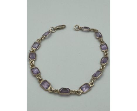 SILVER and AMETHYST BRACELET  in tennis bracelet form having 12 amethyst gemstones  individually mounted and connected with s