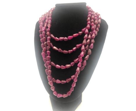 An 810ct Ruby Five-Strand Teardrop-Shaped Beaded Necklace. 40 - 48cm. Beads 10mm. 