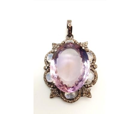 A 33.60ct Natural Amethyst Gemstone Pendant with a halo of diamonds - 1.25ct diamond weight and moonstones weigh 2ct. Metal 9