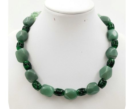 A Rare Chinese Jade Lantern Necklace. Hand-carved jade separated by Chinese lantern jade beads. Complimented by four strands 