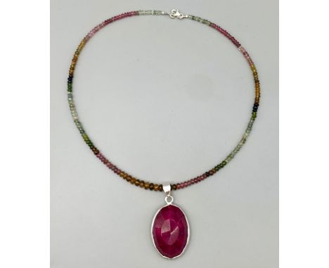 A Ruby Pendant with a matching tourmaline string, which can be removed , ruby weight approx 120cts set in 925 silver 