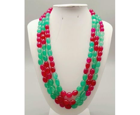 A 745ct Emerald and Ruby Three-Strand Beaded Necklace. 44 - 48cm. Beads 10mm. 