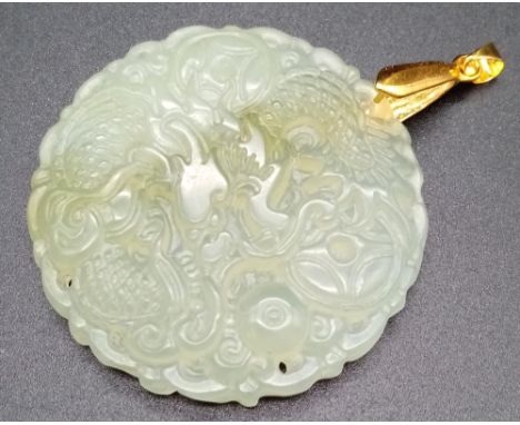 A Translucent Green Jade Pendant. 5cm diameter. 