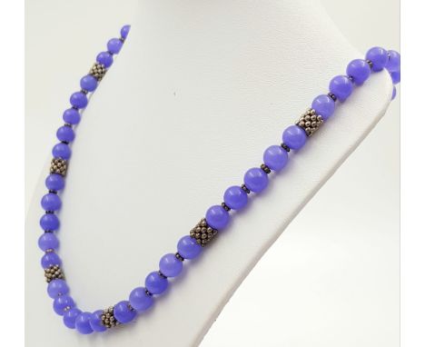 A Beautiful Lavender Jade Bead Necklace. 8mm beads with a heart clasp. 44cm. Comes in a presentation case. 