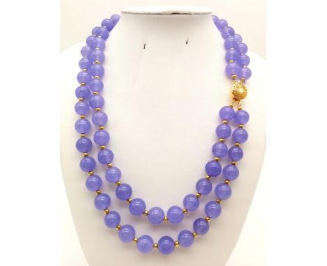 A Two-Row Lavender Jade Bead Necklace. Gold plated clasp. 44cm. 