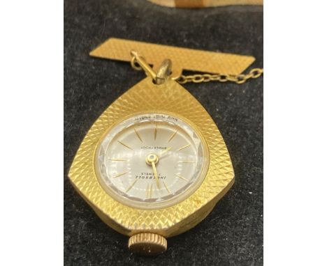 Vintage Ingersoll Pendant watch in nurses upside down style. Gold tone with diamond cut design, manual winding, in full worki