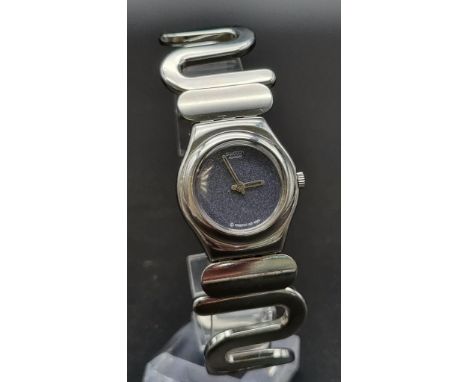A SWATCH "IRONY"QUARTZ BRACELET WATCH WITH A FEW SCRATCHES BUT WORKS PERFECTLY. 