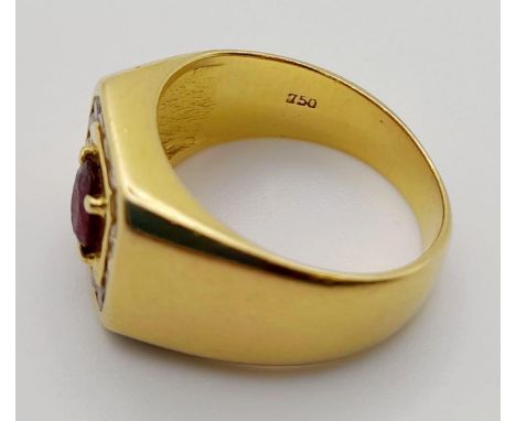 An 18K Yellow Gold Ruby and Diamond Ring. Central ruby stone with a 16 diamond square surround!Size 0 1/2.  10g. 