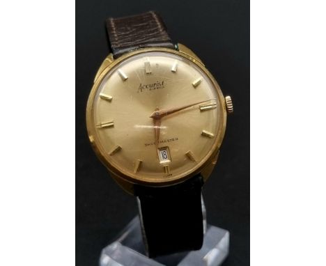 A 1980'S ACCURIST SHOCKMASTER GOLDTONE FACE MANUAL MOVEMENT , A FEW SCRATCHES ON GLASS. IN ORIGINAL BOX WITH INSTRUCTIONS. 