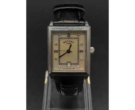 A ROTARY LADIES TANK STYLE WATCH WITH MOTHER OF PEARL FACE AND DIAMOND NUMERALS, QUARTZ MOVEMENT AND LEATHER STRAP. 