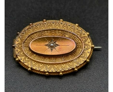 A Victorian, 15 K yellow gold brooch locket with a seed pearl at centre. Dimensions: 31 x 22 x 5 mm, weight: 4.95 g. In origi