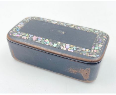An Antique Papier Mache Snuff Box with Mother of Pearl Inlay. 2 x7cm. 