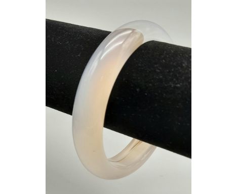 A Translucent White Jade Bangle - 6cm inner diameter. 