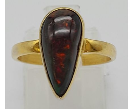 A Silver Gilt Fire Opal Teardrop Ring. Size O. 