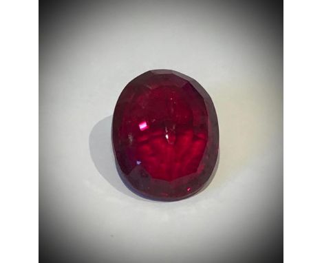 An A Rated Positive Blood-Red 60ct Mozambique Ruby. Oval-cut with no visible marks or inclusions. 26 x 21 x10mm. Mild heat tr
