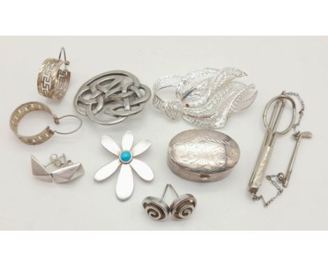 Mixed Silver Lot: Two brooches, one Pendant, one tie-pin, one trinket box, and three pairs of earrings. 40g total weight. 