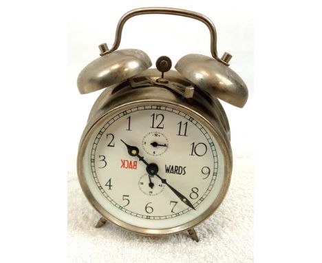 A Novelty Backwards Double Bell Alarm Clock. In working order. 