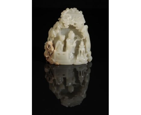 A CHINESE CELADON JADE CARVING OF TWO FIGURES IN A PAVILION surrounded by pine, bamboo and rockwork, Qing or later,  12cm x 1