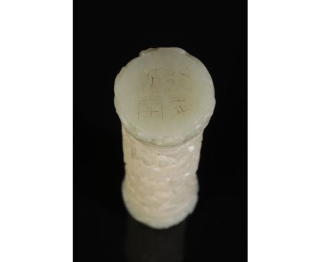 A CHINESE WHITISH CELADON JADE PARFUMERIE of cylindrical form, the body finely carved and pierced with pavilions amidst rocky