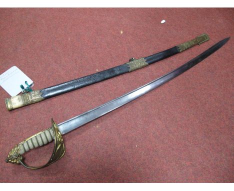 A Mid XX Century Royal Navy Officers Dress Sword, lion head pommel to brass guard with naval cypher, etched 81cm blade, inscr