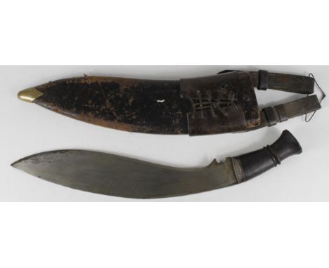 An impressive Great War period Indian, Military pattern, Kukri. 14" Heavy broad blade in v.g.c. no markings. Wooden grip with