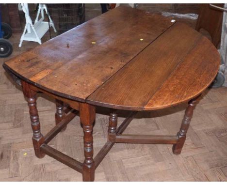 George III oak gate-leg dining table. No condition reports for this sale.