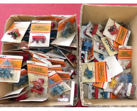 72 ERTL die cast 1/64 scale farm models, mostly in original blister packs No condition reports for this sale.