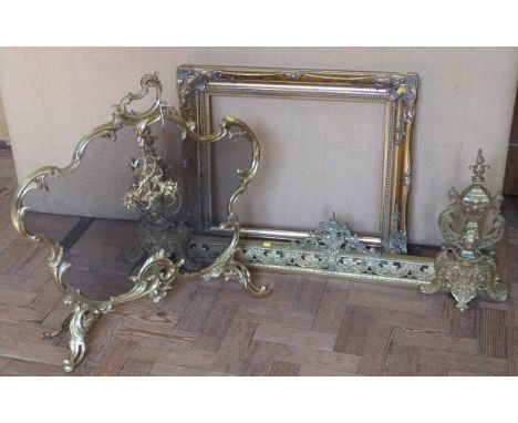 Adjustable brass Victorian fender stamped EGB, brass and wire Rococo style spark guard and a gilt picture frame. No condition