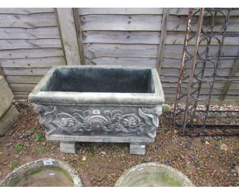 Large decorative stone planter with feet