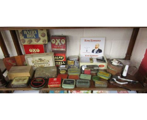 Shelf of smoking ephemera and old tins
