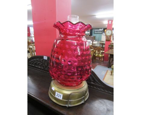 Unusual brass oil with lamp red glass shade