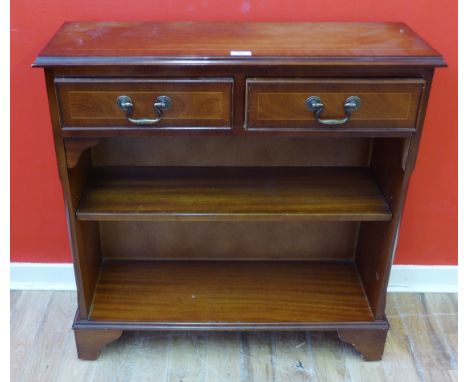 A reproduction mahogany open bookcase having two short drawers to top above two shelves raised on bracket feet, 78 x 79cm