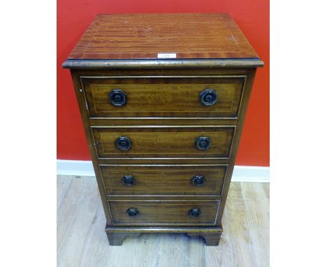A mahogany chest of drawers having a moulded top above four drawers raised on bracket feet, 42 x 76cm