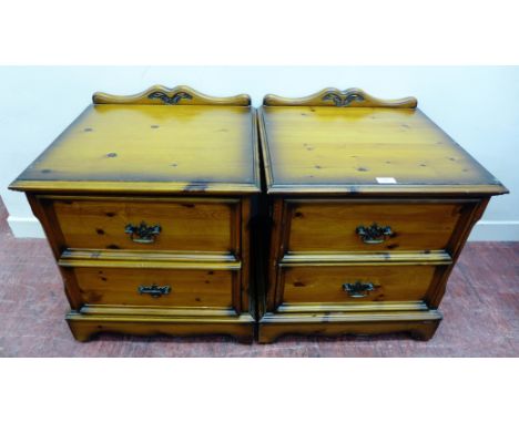 A pair of contemporary pine bedsides, each having two drawers and raised on bracket feet, 52 x 61cm