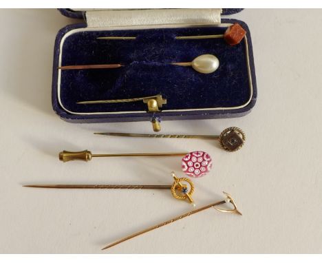 A collection of stick pins to include 9 carat and 15 carat examples, and five others (7) 