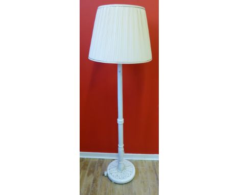 A white painted standard lamp, complete with shade, 170cm high
