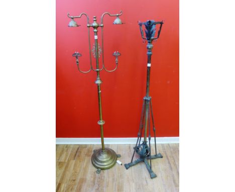 An Edwardian brass standard lamp, 145cm high, together with a 19th century adjustable brass oil lamp stand, 136cm high 