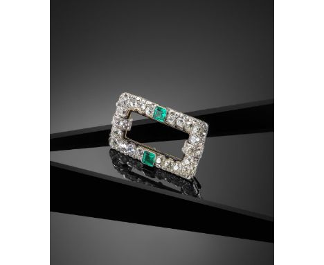 An Art Deco emerald and diamond plaque brooch by Cartier, of open rectangular form and pave set with graduated cushion shaped