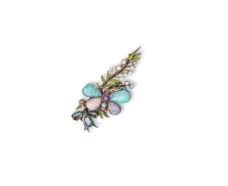 A gem set and enamel gold butterfly brooch, the butterfly with opal wings and a ruby and diamond set body, perched amongst fo