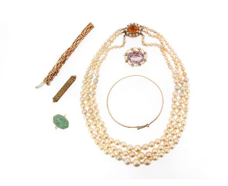 A three row graduated cultured pearl necklace, with citrine and seed pearl set gold clasp. A carved jade disc ring, a gold fa