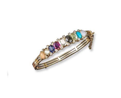 A gem-set gold hinged bangle, mounted with various stones including a cushion-shaped diamond, a ruby, a sapphire, a pearl, co