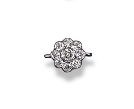 A diamond cluster ring, the centre round brilliant-cut diamond is set within a surround of eight smaller diamonds in white go